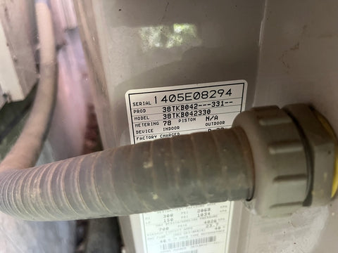 Close up view of label on Carrier model # 38TKB042330 condenser. 