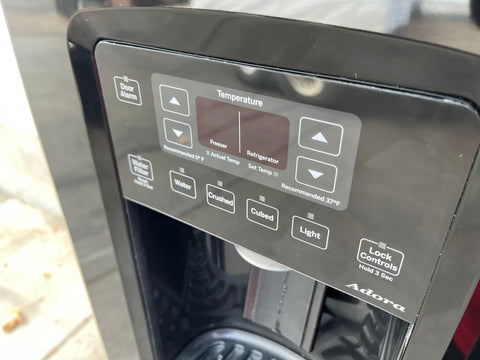 Close-up of exterior control panel on GE side-by-side 36" refrigerator. 