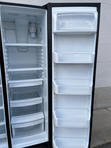 Refrigerator interior of GE DSE25JGHBCBB with adjustable shelves and door bins. 