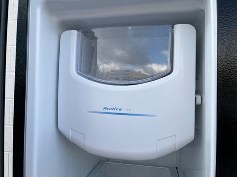 Detail of removable ice bin with access door in General Electric refrigerator. 