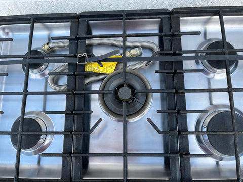 Detail of 5 burners and removable, washable grates on KitchenAid KFGS06VSS02 30" gas cooktop. Includes gas line. 