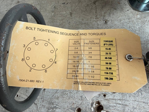 Bolt tightening sequence and torques chart tag on reclaimed 6" butterfly valve. 