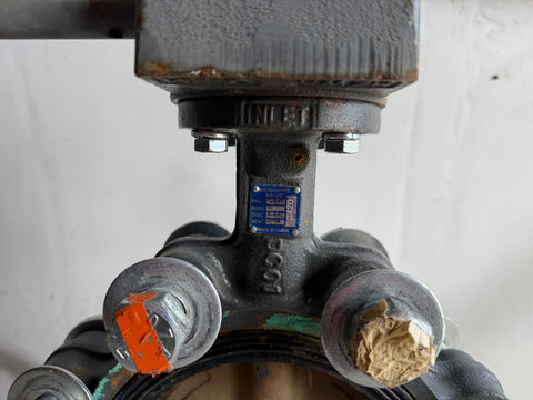 Detail of label on good, used Milwaukee 6" butterfly valve. 