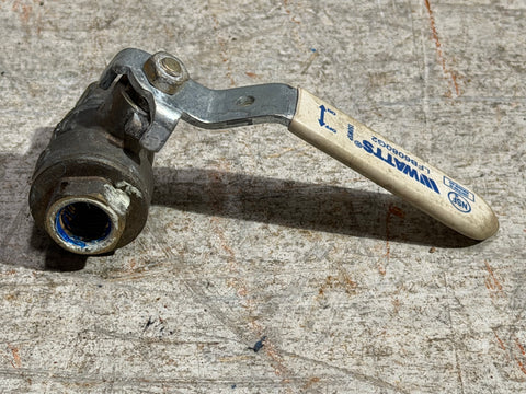 Ball valve with WATTS logo on rubberized metal handle. 