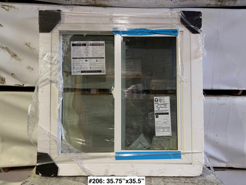 Single slider, vinyl frame, 35.75"35.5" Pella window with cracked pane. 