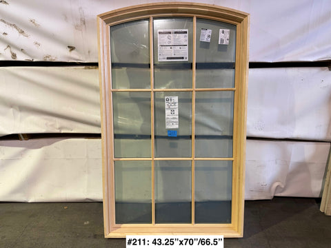 Pella fixed, arch top, wood frame, 2-pane window with grid. 43.25"x70"/66.5". 