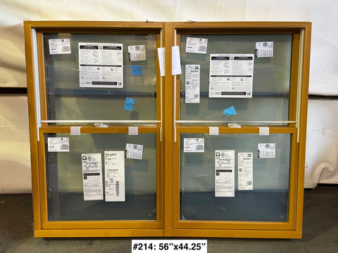 Dual double-hung window by Pella with wood & metal frame, sized 56"x44.25". 