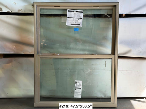 Beige vinyl framed, 2-pane, dual hung Pella window measuring 47.5"W x58.5"H. 