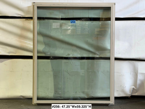 Used Amsco fixed window with beige vinyl frame & trim fin. 
