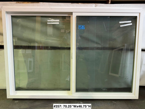 New Amsco single slider window with white vinyl frame & trim fin. 