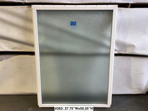 New, fixed Amsco window with ripple-pattern privacy glass in white vinyl frame. 