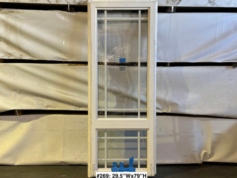 Good, used, white vinyl-framed window with grid and nail fin by Amsco. Fixed upper & casement lower. 