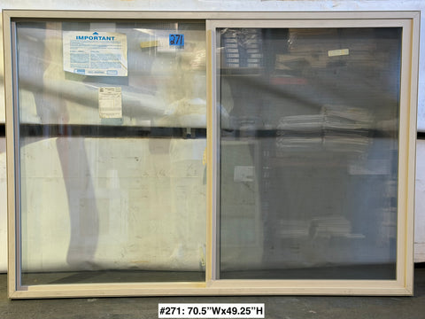 New Amsco single slider window in beige vinyl. 