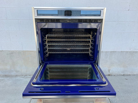 Interior view of upper oven in Wolf D030F/S, featuring multiple racks. 