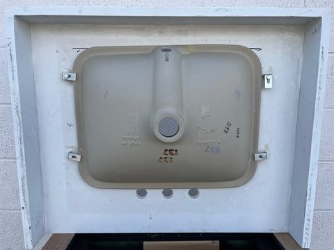 Underside of quartz vanity counter top showing rectangular sink mounting. 