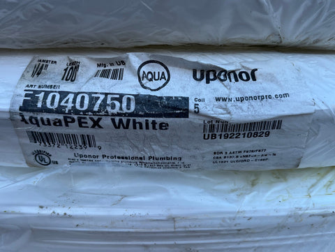 Label detail on coil of 3/4" x 100' Uponor AquaPEX white plumbing pipe. 