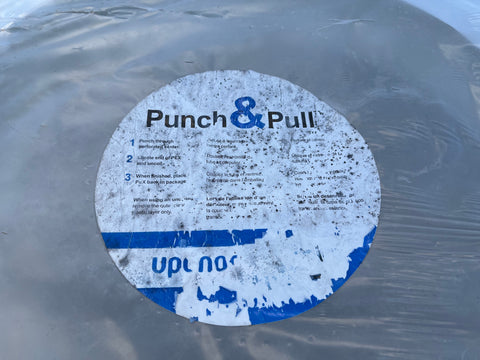 Usage instruction label on 100' coil of Uponor 3/4" PEX piping. 