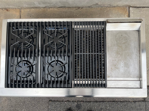 Top view of Thermador gas cooktop featuring 4 burners, a grill and griddle. 