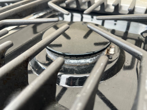 Detail of burner on Thermador gas stovetop, featuring electronic ignition. 