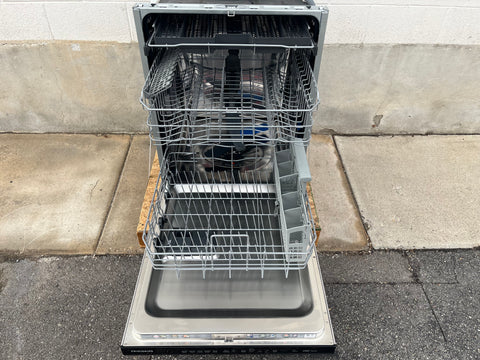 Interior of Frigidaire dishwasher with 3 racks. 
