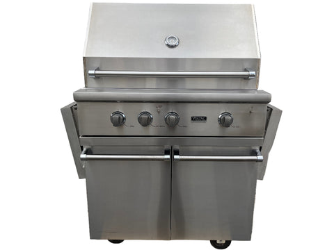 Stainless steel grill with three knobs on a white background