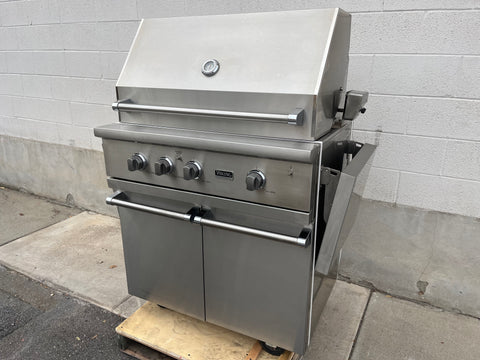 Stainless steel grill with cart. 
