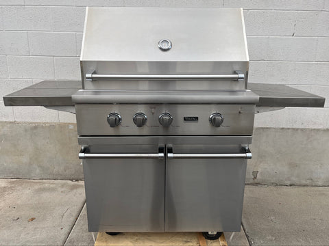 36" Viking stainless steel grill with control knobs and fold-out trays. 