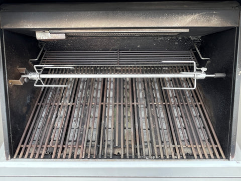 Interior of Viking grill featuring adjustable rotisserie & 2-position warming rack. 