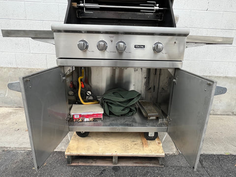 Viking grill cart interior with space for LP tank and other accessories. 