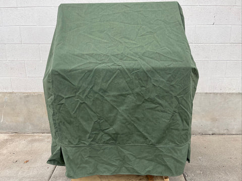 Included green canvas cover over 36" Viking grill. 