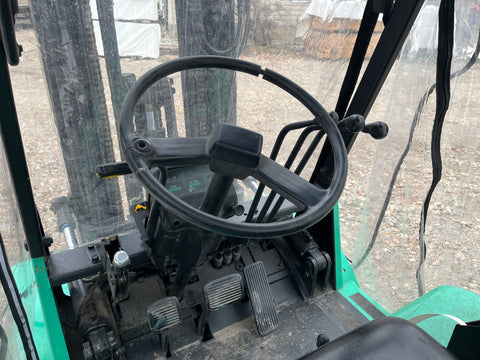 Steering wheel, hand controls & foot pedals on Mitsubishi LP lift truck. 