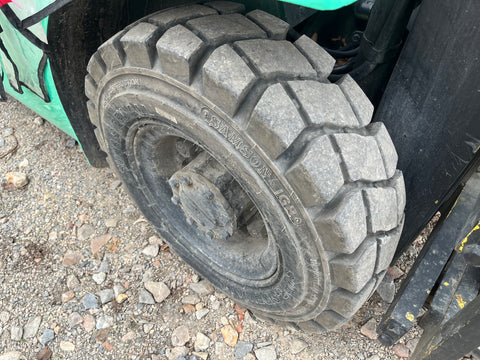 Right front wheel and tire on 4000 pound Mitsubishi forklift. 