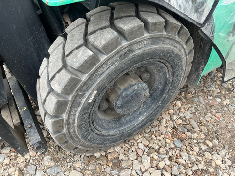 Left front pneumatic tire on Mitsubishi FG20 forklift. 