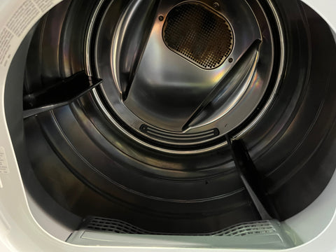 Interior view of Frigidaire Affinity gas dryer showing stainless steel drum. 