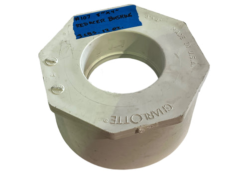 Model #107, 8"x4" flush reducer bushing by Charlotte Pipe. Made of schedule 40 white PVC. Use in non-pressure DWV systems. 