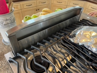 Partially retracted BEST 36" built-in, countertop, downdraft range hood. 