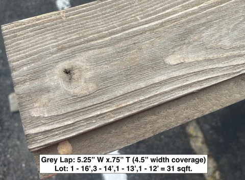 Close-up of gray lap siding grain. 