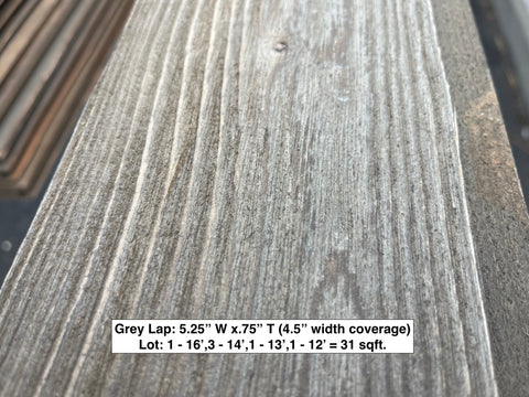 Grain & color detail of gray lap solid wood siding. 