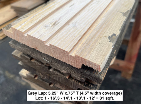 End detail of 31 square foot lot of gray lap solid wood siding. 