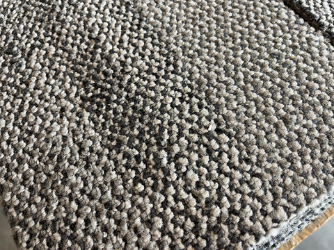 Good used 10"x39.5" commercial carpet tiles in light gray with black, gray, blue & maroon. 