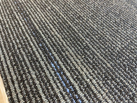 Reclaimed, 18x36 inch, 3/8" thick, black with gray & blue lines pattern commercial carpet. 