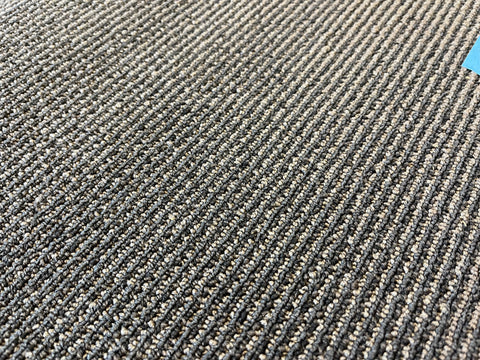 18"x36", black/gray lined, used commercial carpet tile. 