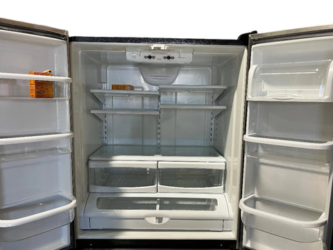 Interior view of Ikea # IX5HHEXWS09 refrigerator featuring adjustable shelves and bins. 