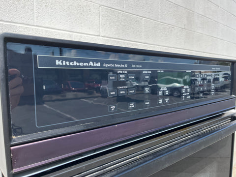 Detail of left side of control panel of KitchenAid Superba Selectra 30 self cleaning double oven with digital display and touch controls. 