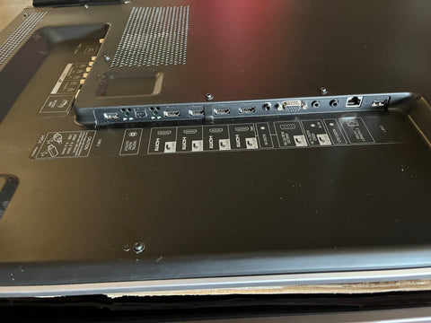 Detail of multiple HDMI inputs and various other connections on back of Sharp AQUOS #LC-60LE810UN 60" smart HDTV. 