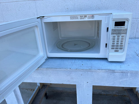 Reclaimed Hamilton Beach #HB-P100N30AL-S3 microwave oven with door open, showing interior with carousel. 