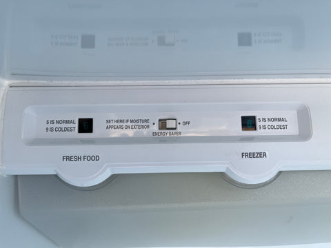 Close-up view of fridge and freezer controls inside G.E. ZISB42DCA built-in refrigerator, including energy saver option. 