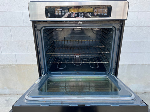 Interior view of upper oven and control panel of General Electric JTP50S0H2SS in-wall double oven. 