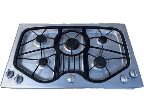 Overview of reclaimed JennAir stainless steel 36" gas stovetop with 5 burners and removable grates, model # JGC8536ADS. 