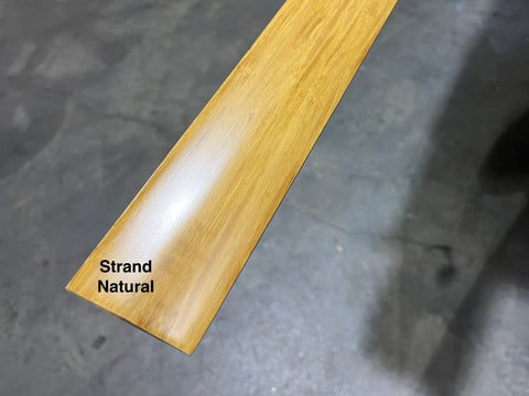 Detail of strand natural finish solid wood floor reducer. 